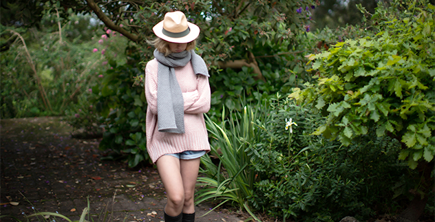 Pink chunky cable knit jumper in garden on girl with hat - Luna Gallery